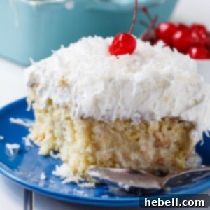 Pina Colada Poke Cake, a delightful tropical dessert for summer parties.