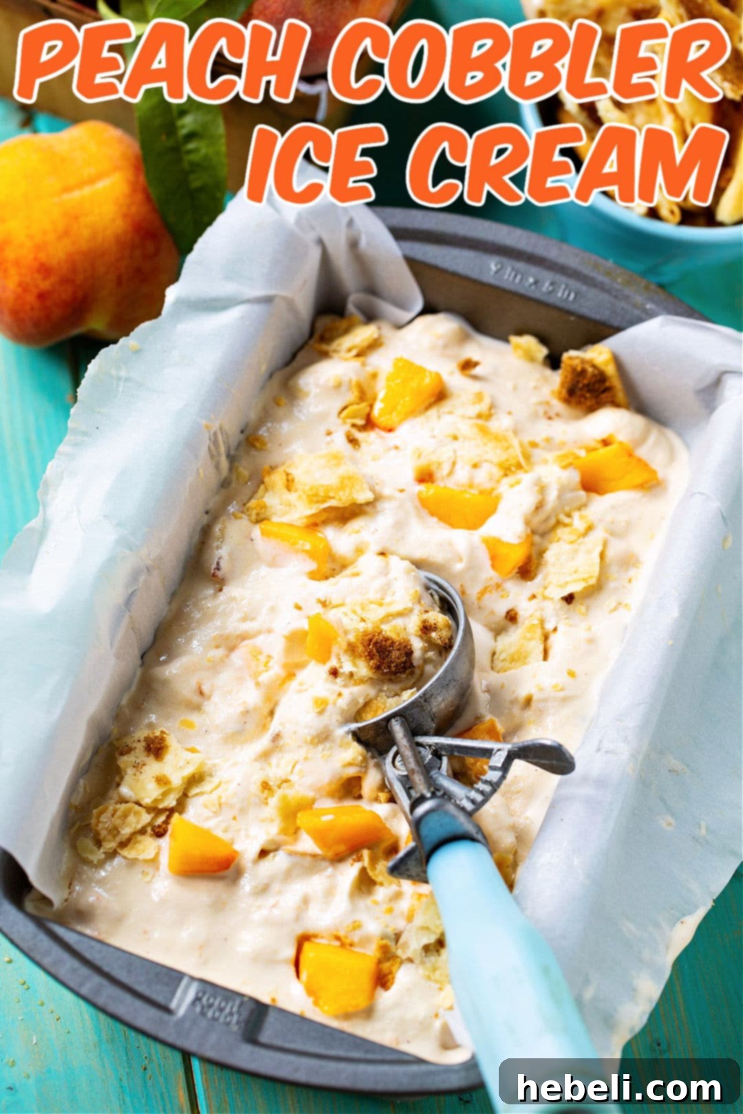 Homemade Peach Cobbler Ice Cream showcased in a 9x5-inch baking dish, highlighting its creamy texture and visible pie crust pieces.