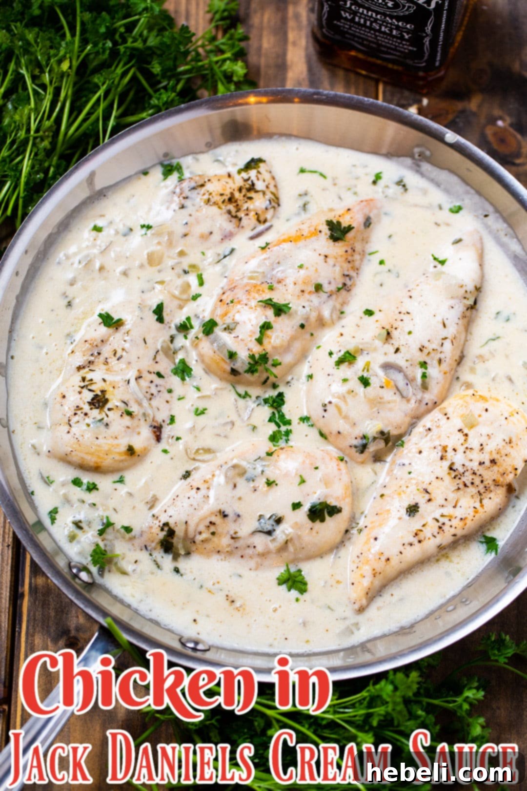 A generous serving of Chicken in Jack Daniels Cream Sauce, garnished with fresh parsley, presented in a large skillet, ready for the table.