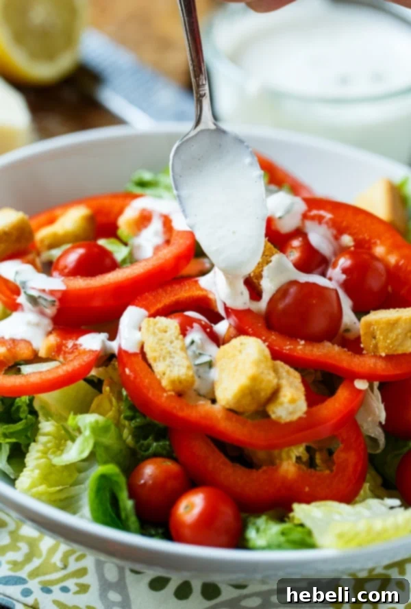Carrabbas Style Creamy Parmesan Dressing 5 A close-up of Creamy Parmesan Dressing (Carrabba's copycat) in a serving bowl, ready to be drizzled over a fresh salad.
