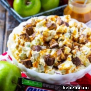 Snickers Caramel Apple Salad in a bowl.