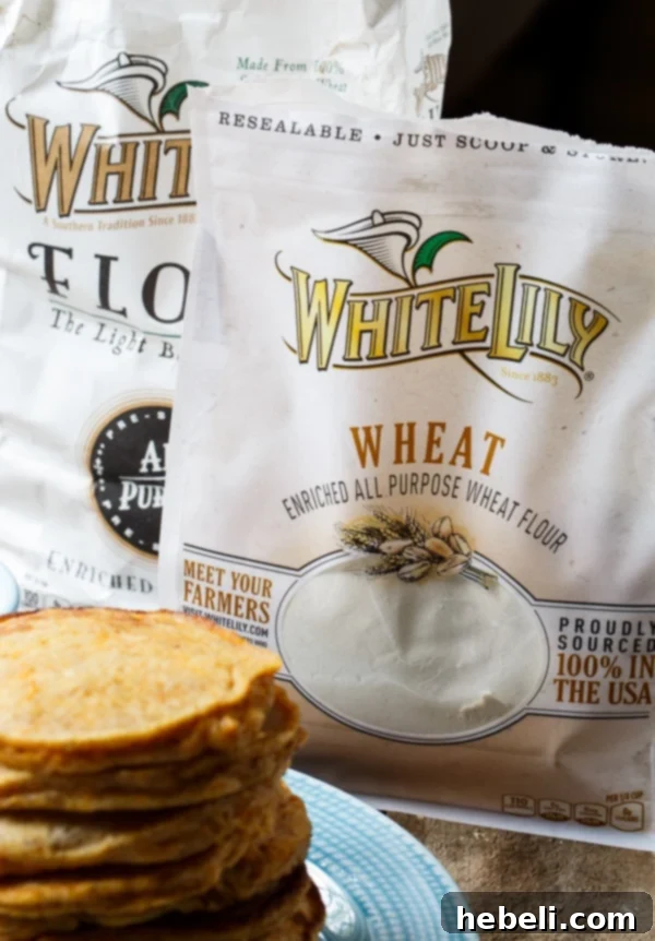 Preparing the sweet potato mash for the pancake batter, showing the rich color of the vegetable.