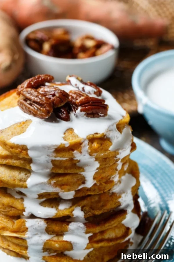 Sweet Potato Pancakes cooking on a griddle, showing their perfect round shape and golden edges.