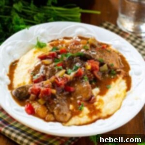 Delicious Grillades and Grits recipe image.