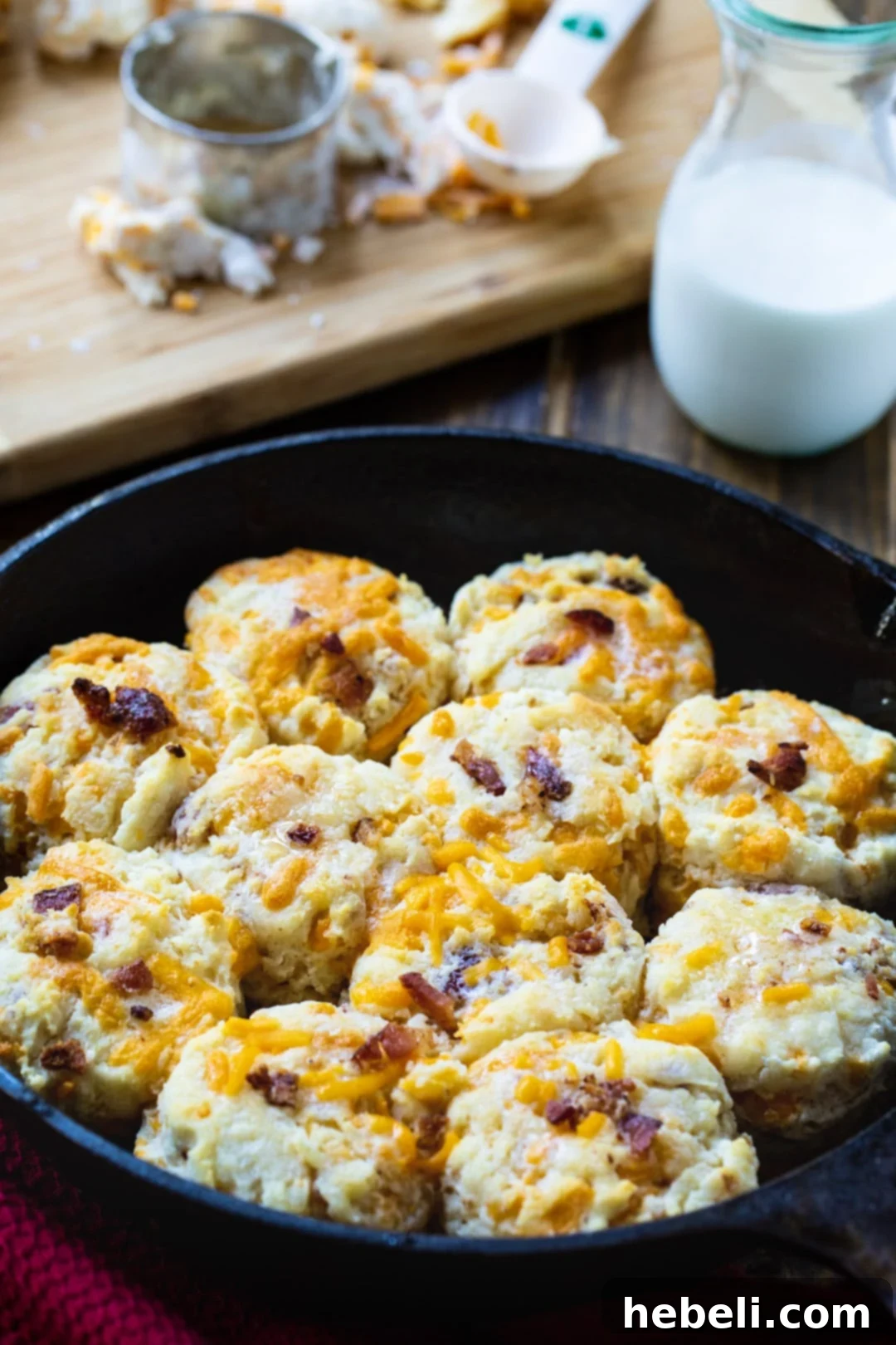 Cheddar Bacon Delights 3 Golden-brown Bacon Cheddar Biscuits baked to perfection in a rustic cast iron pan.