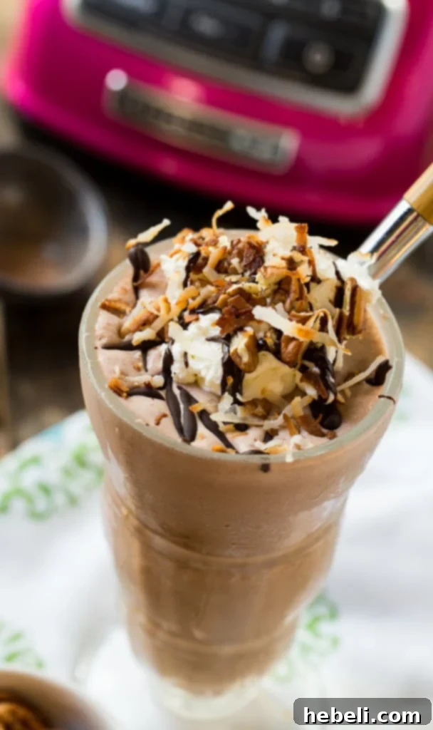 Delicious German Chocolate Milkshake with chocolate drizzle and whipped cream
