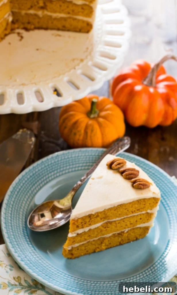 Golden Butterscotch Pumpkin Bliss 3 Close-up slice of moist Butterscotch Pumpkin Cake revealing its tender layers and butterscotch frosting
