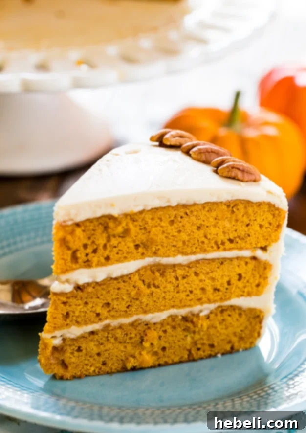 Golden Butterscotch Pumpkin Bliss 6 Closeup of a delectable slice of Butterscotch Pumpkin Cake, highlighting its moist interior and generous butterscotch icing