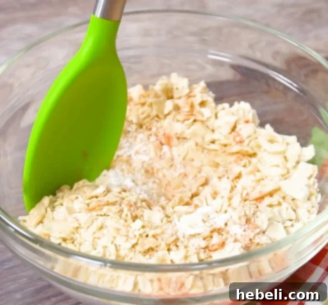 Bowl showing a mixture of flour, crushed saltine crackers, and spices