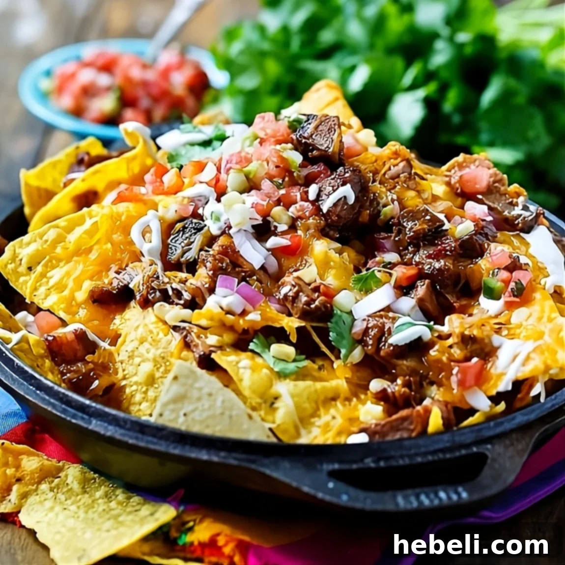 Ultimate Brisket BBQ Nachos 2 Delicious BBQ Brisket Nachos served in a rustic cast iron pan, perfect for sharing.