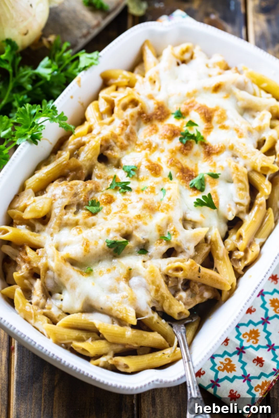 French Onion Pasta served in a pristine white baking dish, ready to be enjoyed.