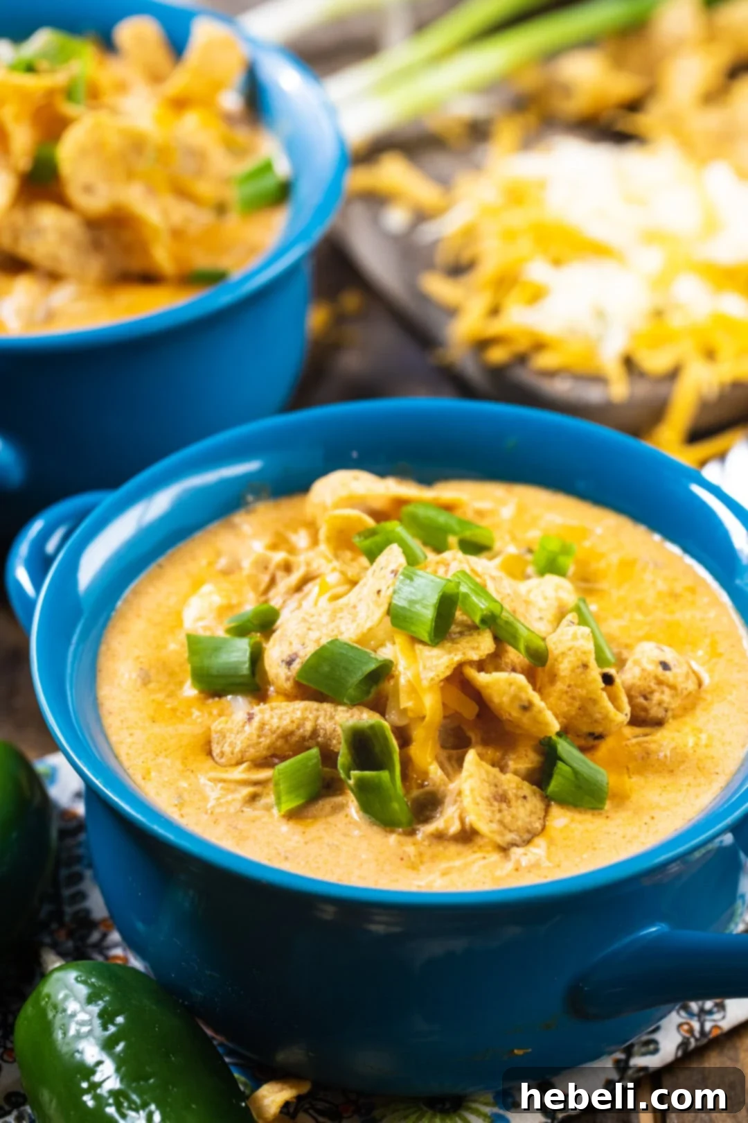 Close-up of Slow Cooker White Chicken Chili in blue soup bowl.