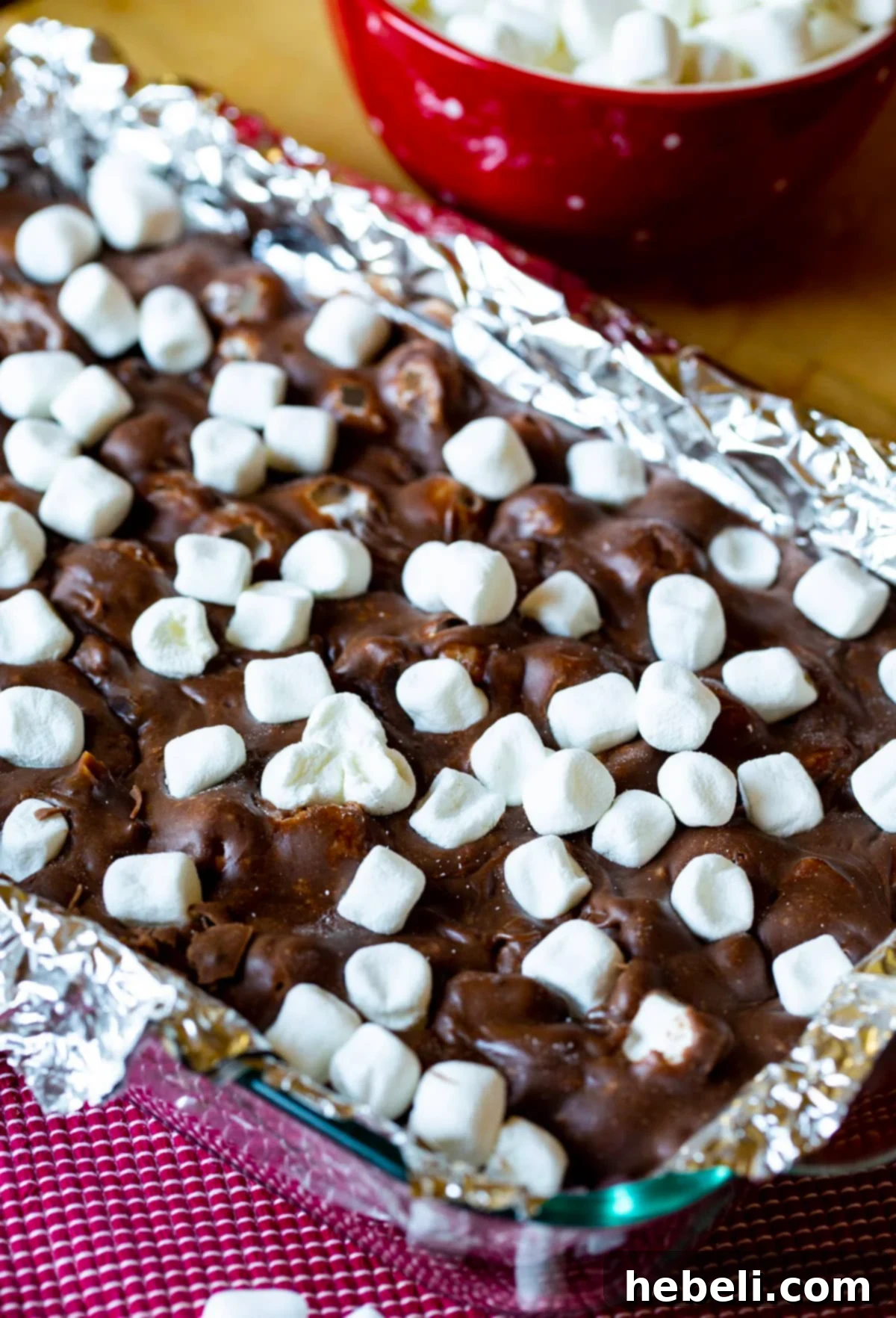 Creamy Rocky Road Fudge cooling in a 9x13-inch pan, before cutting.