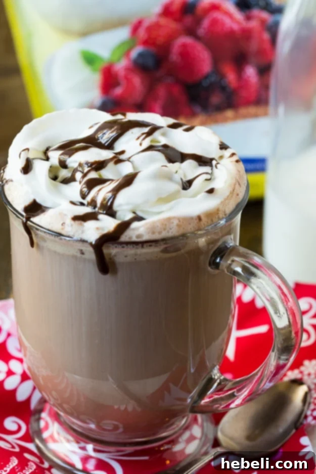 Decadent Mocha Delight 6 Close-up of a mug of Mocha Hot Cocoa with chocolate syrup drizzle