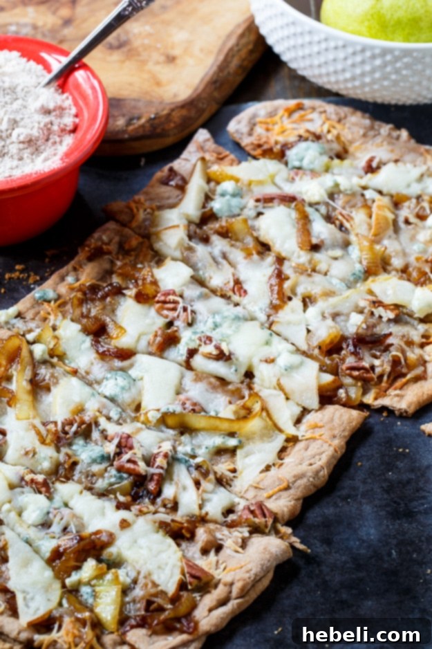 Golden Caramelized Onion and Melted Cheese Flatbreads 3 CHeesy Caramelized Onion Flatbread with pears, blue cheese, and pecans.
