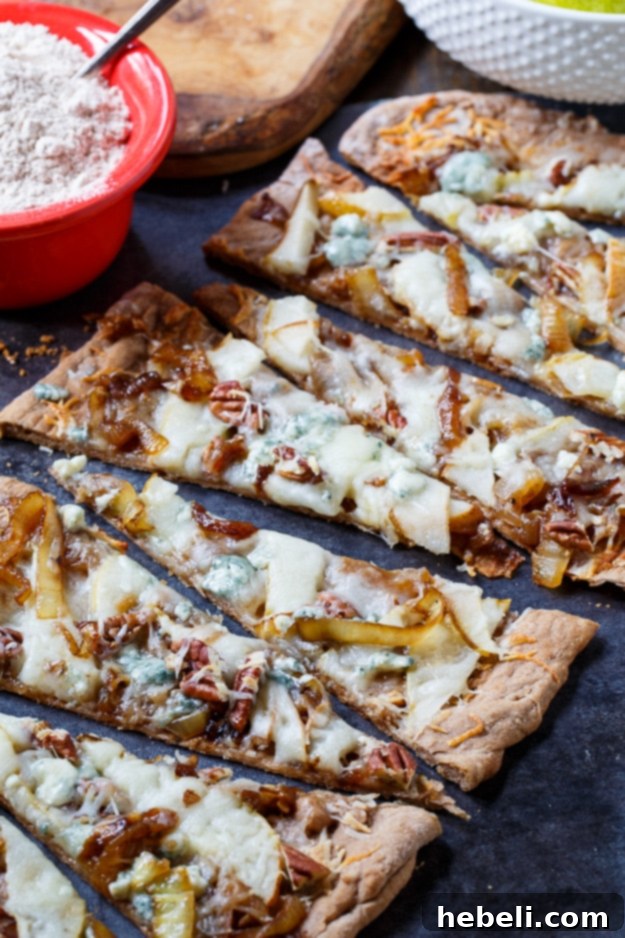 Golden Caramelized Onion and Melted Cheese Flatbreads 4 Cheesy Caramelized Onion Flatbreads with pears, blue cheese, and pecans.