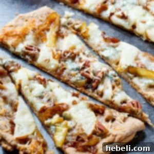 Cheesy Caramelized Onion Flatbreads with pears, blue cheese, and pecans.