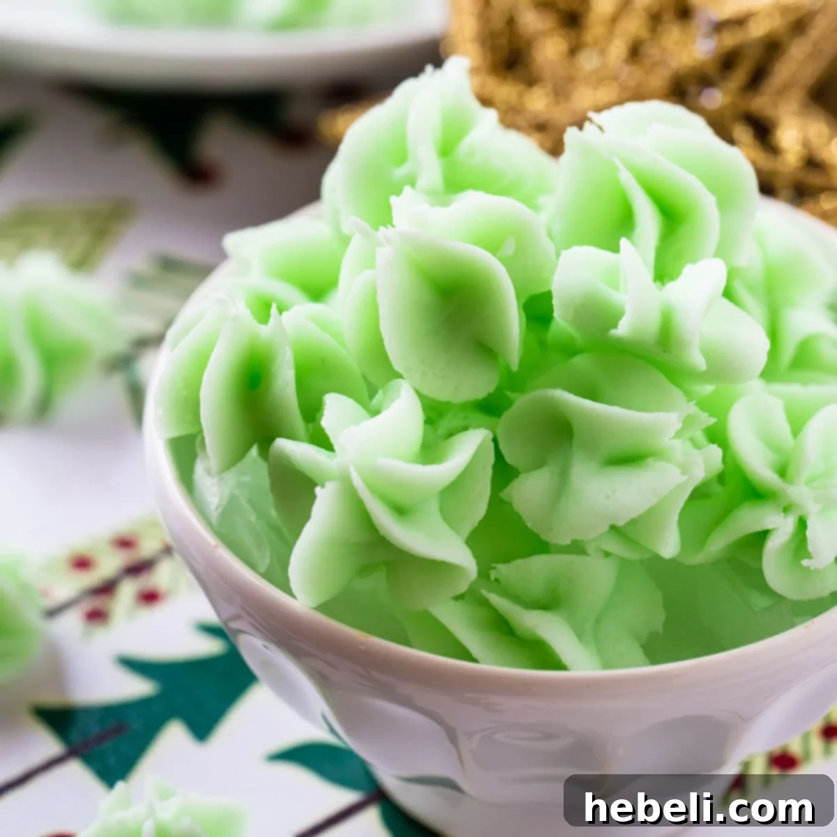 Green Cream Cheese Mints in a bowl, showcasing their vibrant color and delicate texture.