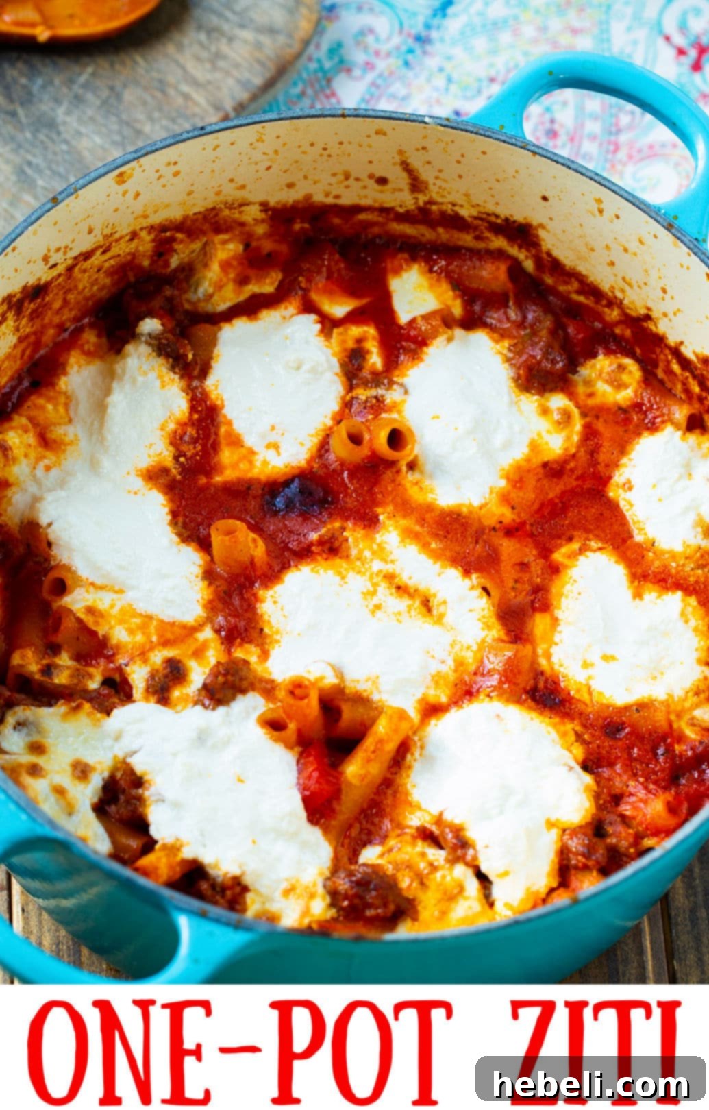 Close-up of creamy, cheesy Ziti pasta cooked in a Dutch oven.
