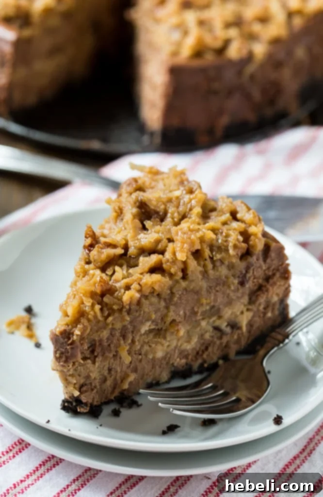 German Chocolate Cheesecake, showing a generous amount of gooey coconut-pecan frosting on top.