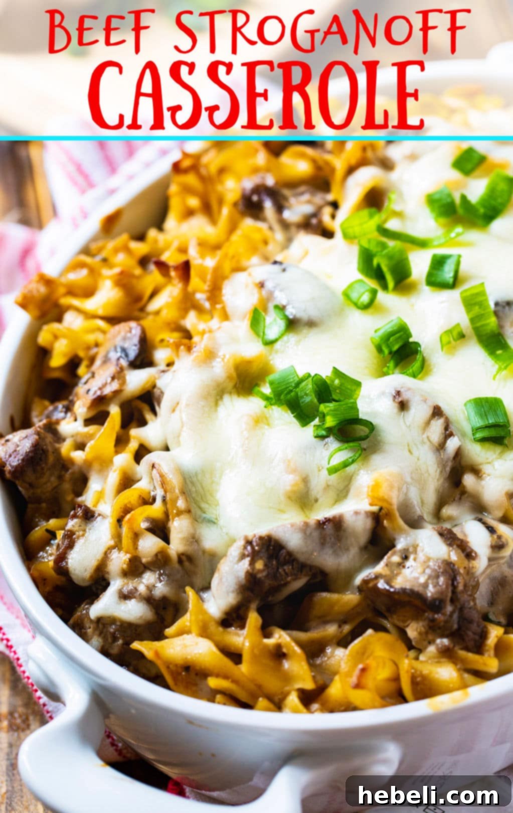 A large serving of Beef Stroganoff Casserole in a deep casserole dish, showcasing its rich texture and topping.