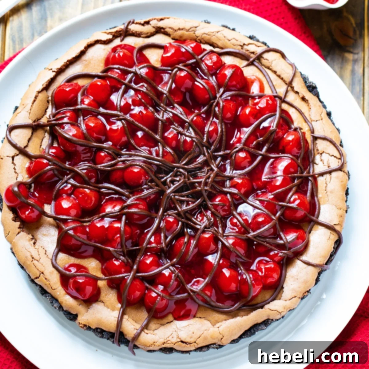 Overhead shot of Black Forest Tart, showcasing its rich chocolate and vibrant cherry topping.