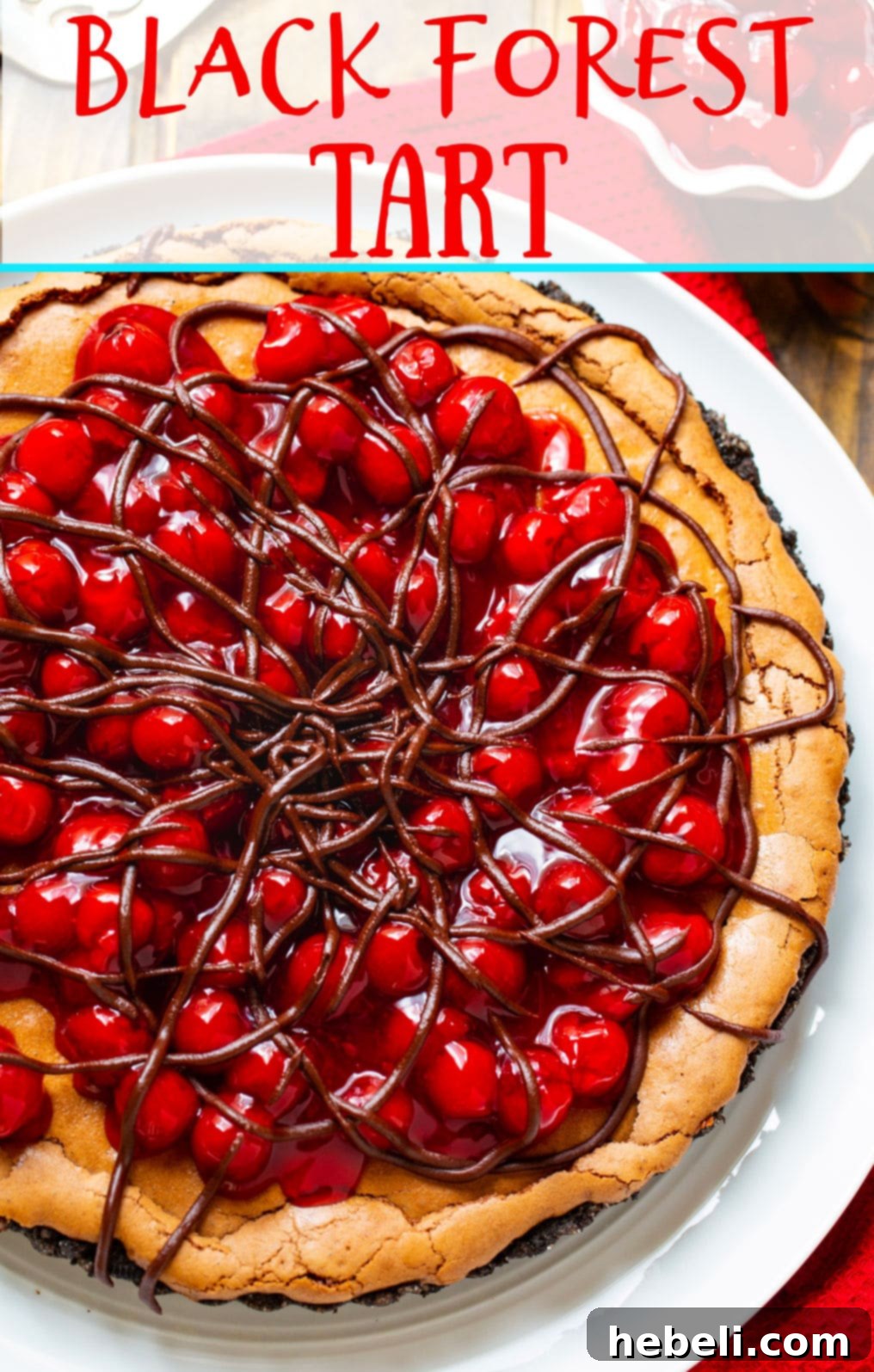 A beautifully presented whole Black Forest Tart on a serving plate.