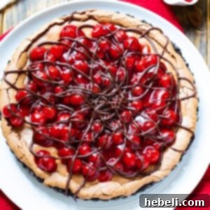 Black Forest Tart with a chocolate cookie crust, rich chocolate filling, and cherry pie topping.