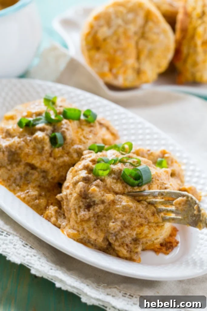 Freshly baked Sweet Potato Biscuits perfectly stacked, ready for gravy