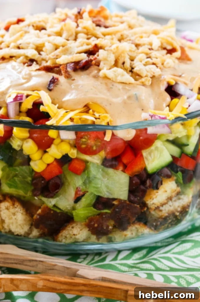 Ultimate Barbecue Ranch Cornbread Salad 7 A top-down view of Barbecue-Ranch Cornbread Salad, showing its colorful layers and delicious toppings.