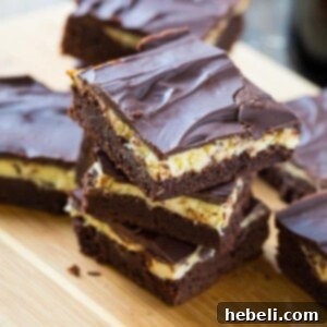 Bailey's Irish Cream Brownies, a top-down shot of the finished product with a slice removed, showing all layers.