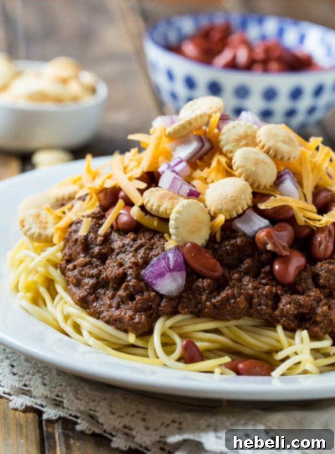 Slow Cooker Cincinnati Chili with a variety of fresh toppings