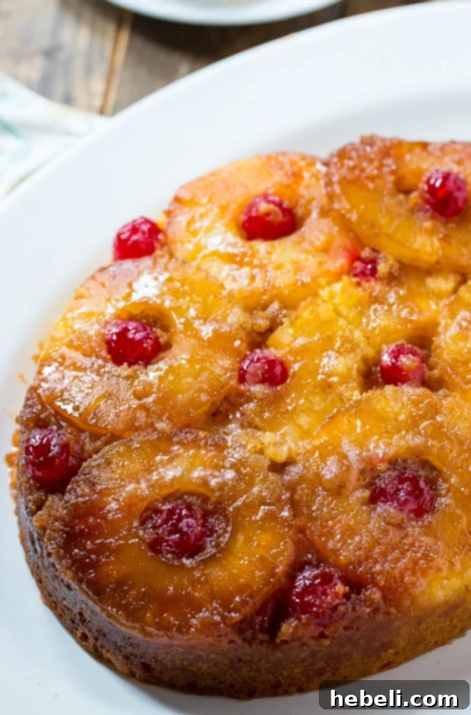 Close-up view of the moist texture and caramelized topping of Slow Cooker Pineapple Upside Down Cake