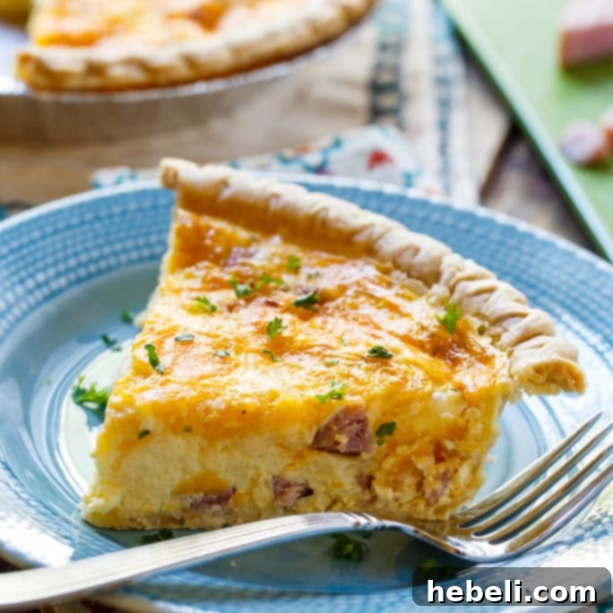 Delicious Easy Ham and Cheese Quiche served on a rustic table
