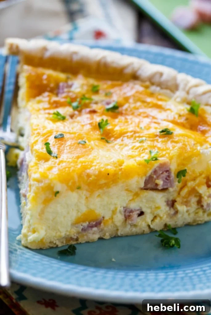 A freshly baked Easy Ham and Cheese Quiche with a golden crust