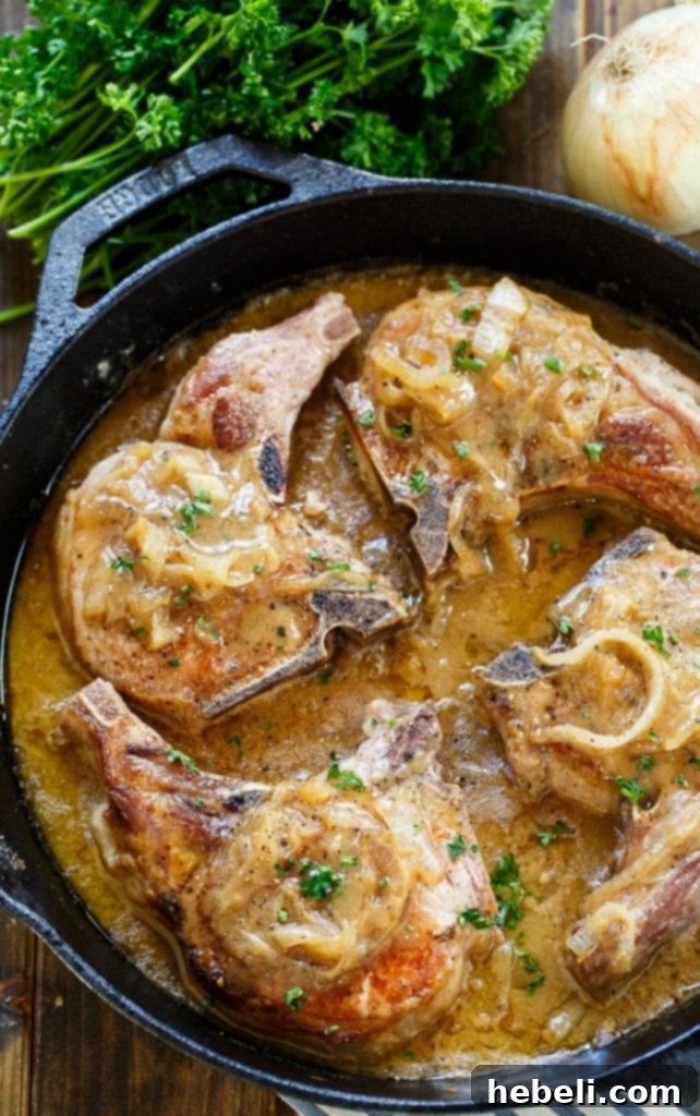 Southern-Style Smothered Pork Chops plated with sides.