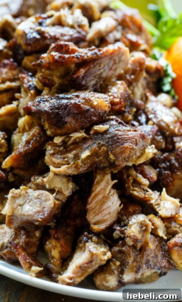 Platter of crispy and tender Pork Carnitas, ready to serve.