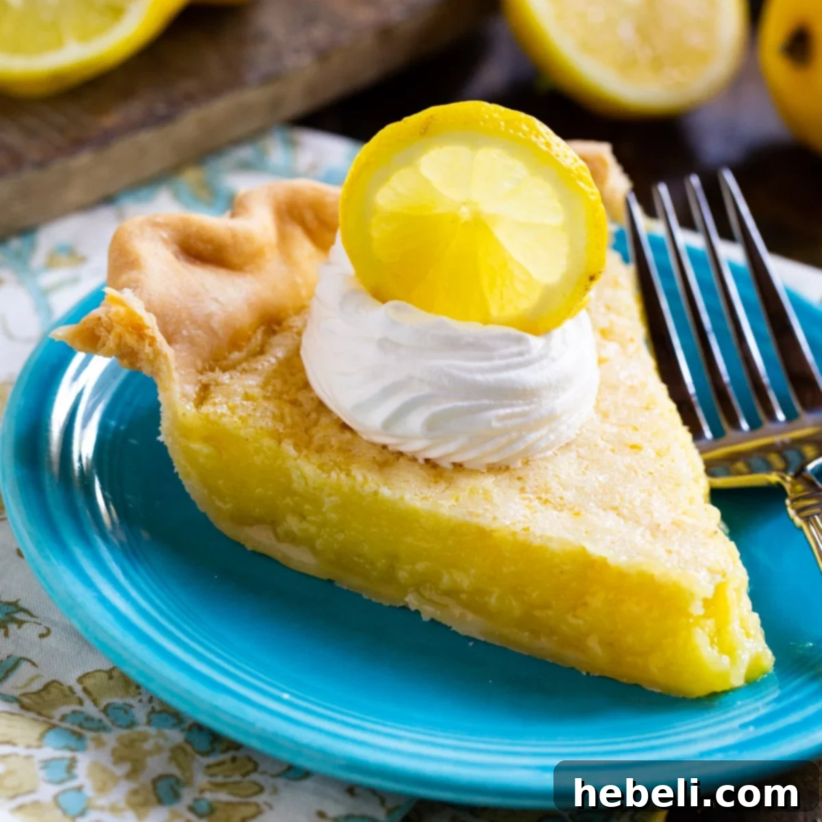 Slice of Lemon Chess Pie on blue plate.
