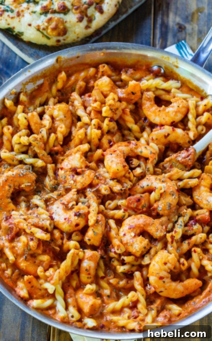 Spicy Shrimp Rose Pasta 3 Spicy Shrimp and Tomato Cream Pasta beautifully plated in a bowl, showcasing its rich texture and vibrant colors.