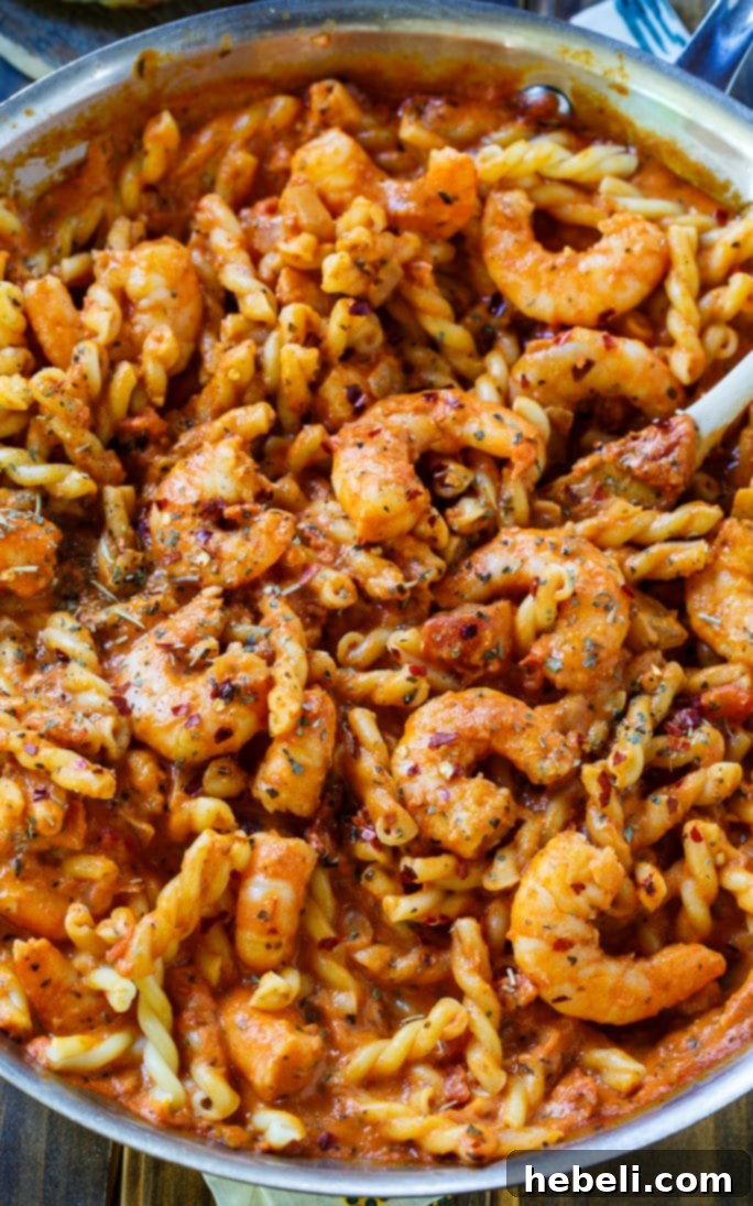 Spicy Shrimp Rose Pasta 4 Fresh ingredients for Spicy Shrimp and Tomato Cream Pasta laid out on a kitchen counter, ready for cooking.