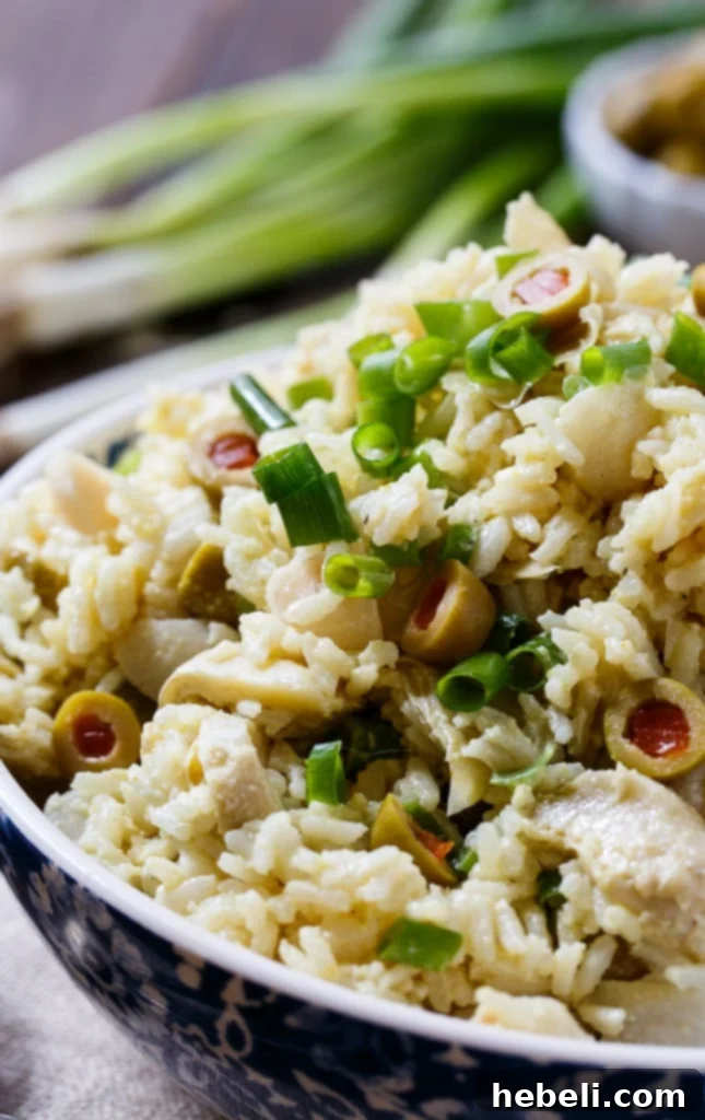 Mediterranean Artichoke Rice Salad 5 Close-up of Artichoke-Rice Salad showing the texture and ingredients like artichoke hearts and olives.