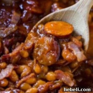 A delicious bowl of Baked Beans with Smoked Sausage, perfect for a hearty meal or side dish.