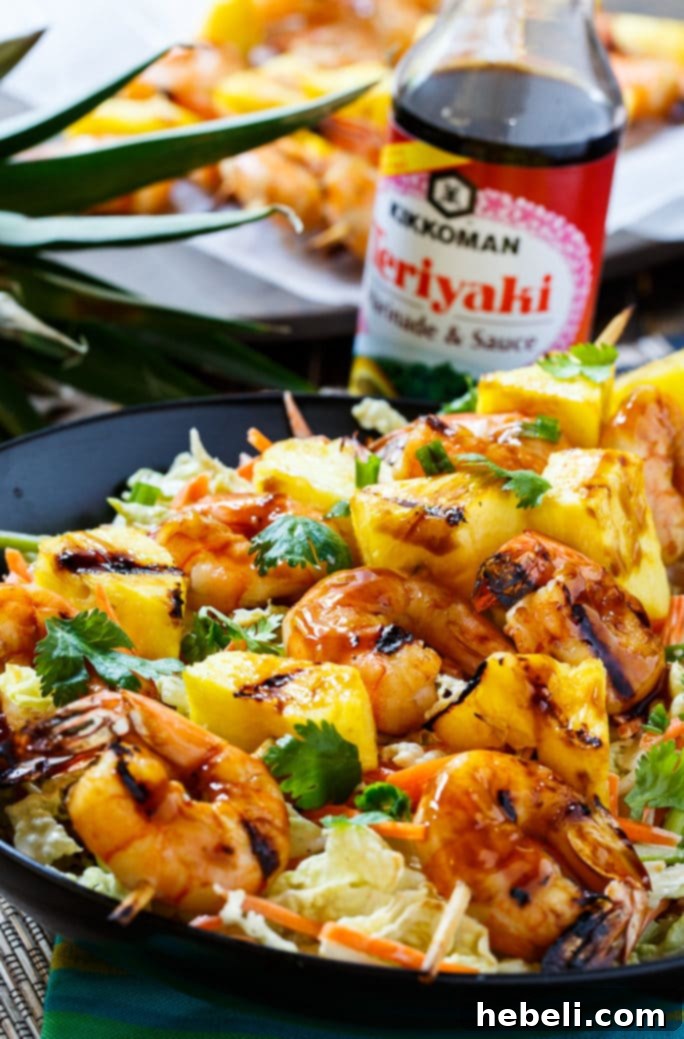 Platter of freshly grilled teriyaki shrimp and pineapple skewers