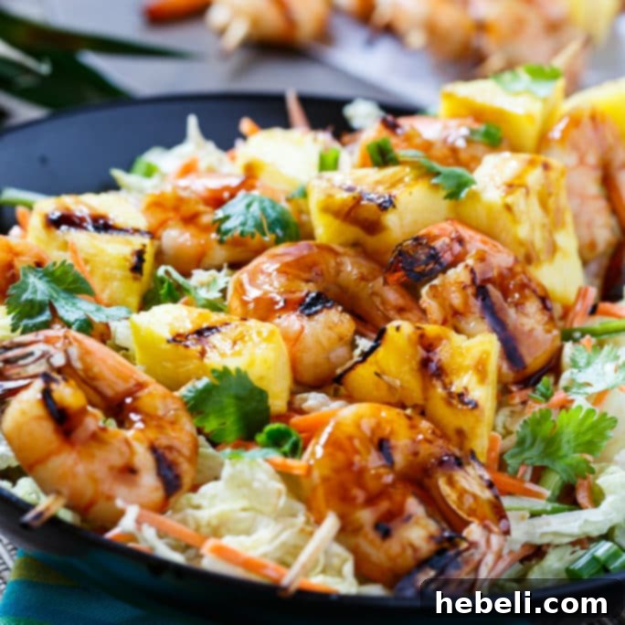 Grilled Teriyaki Shrimp Skewers with Asian Slaw served in a bowl