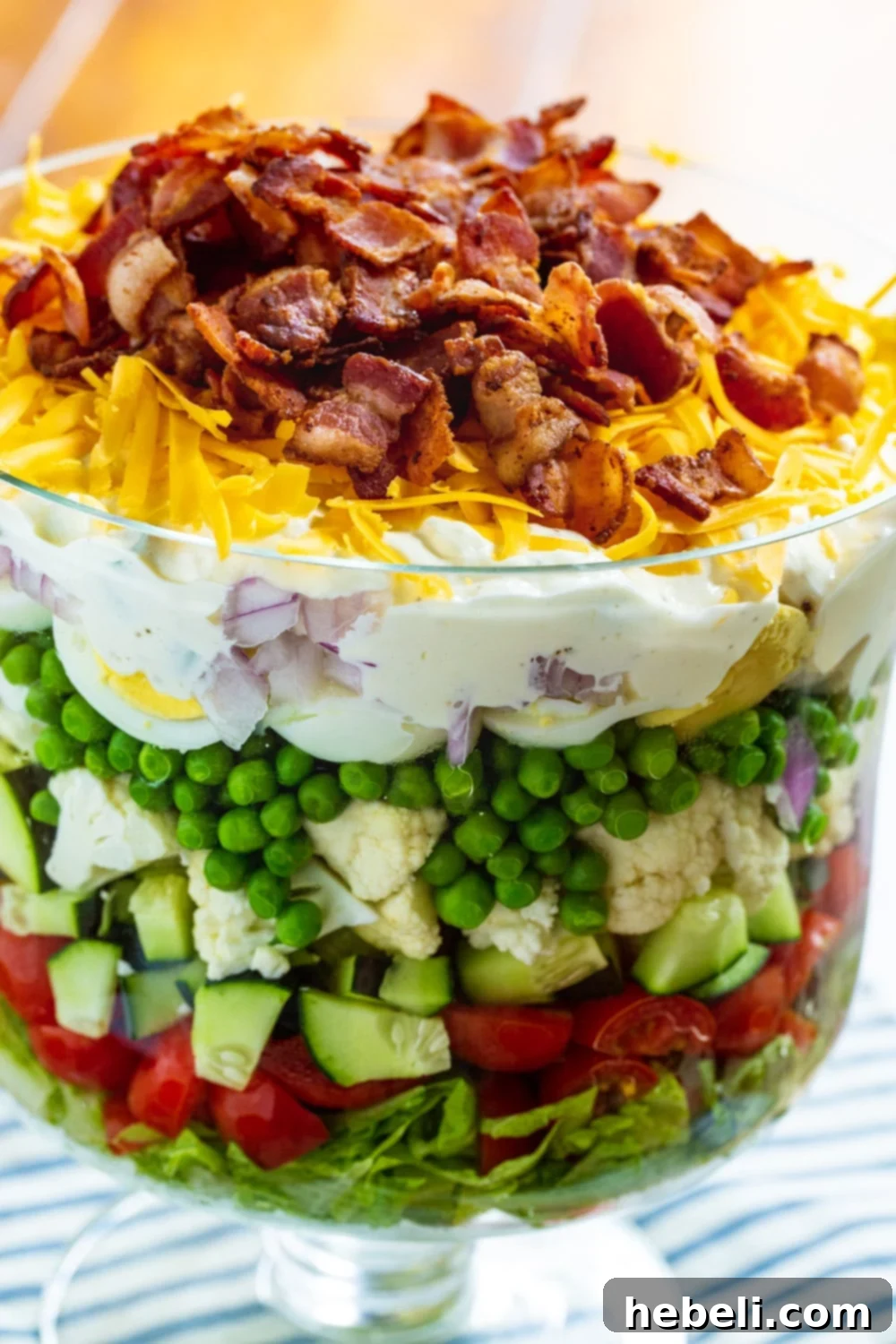 Close-up view of the Seven-Layer Salad, showing the vibrant layers and toppings.