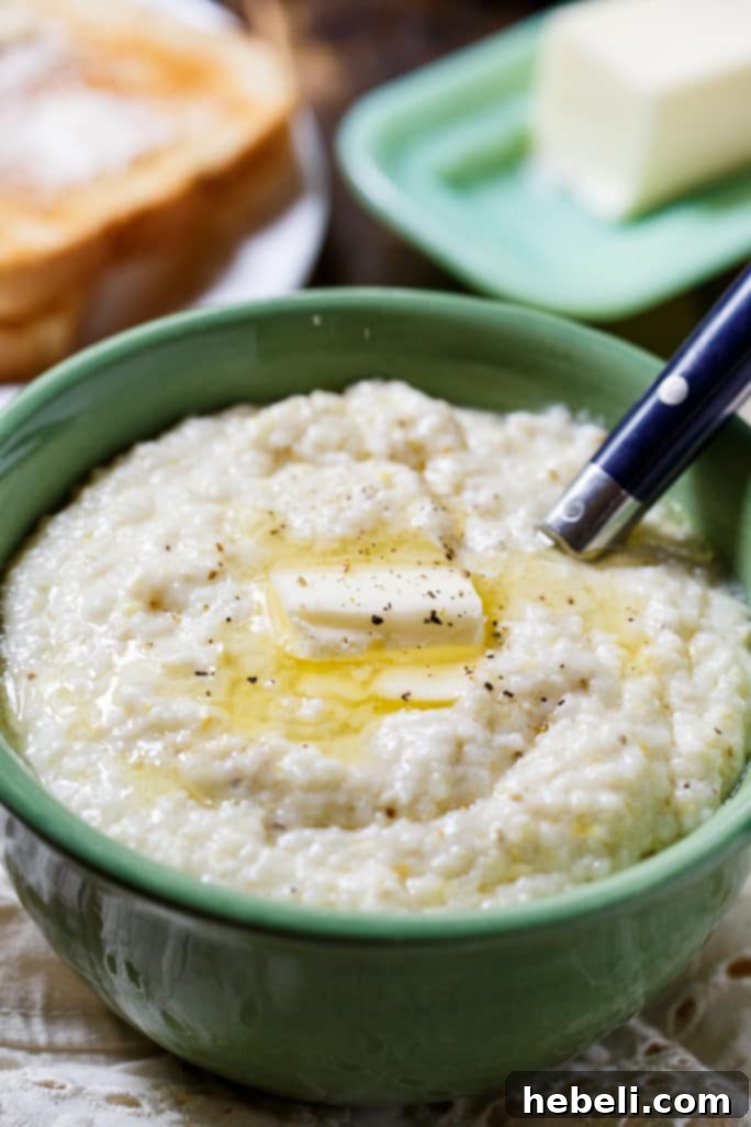 A bowl of creamy grits adorned with fresh herbs, ready to be enjoyed as part of a decadent Southern meal.