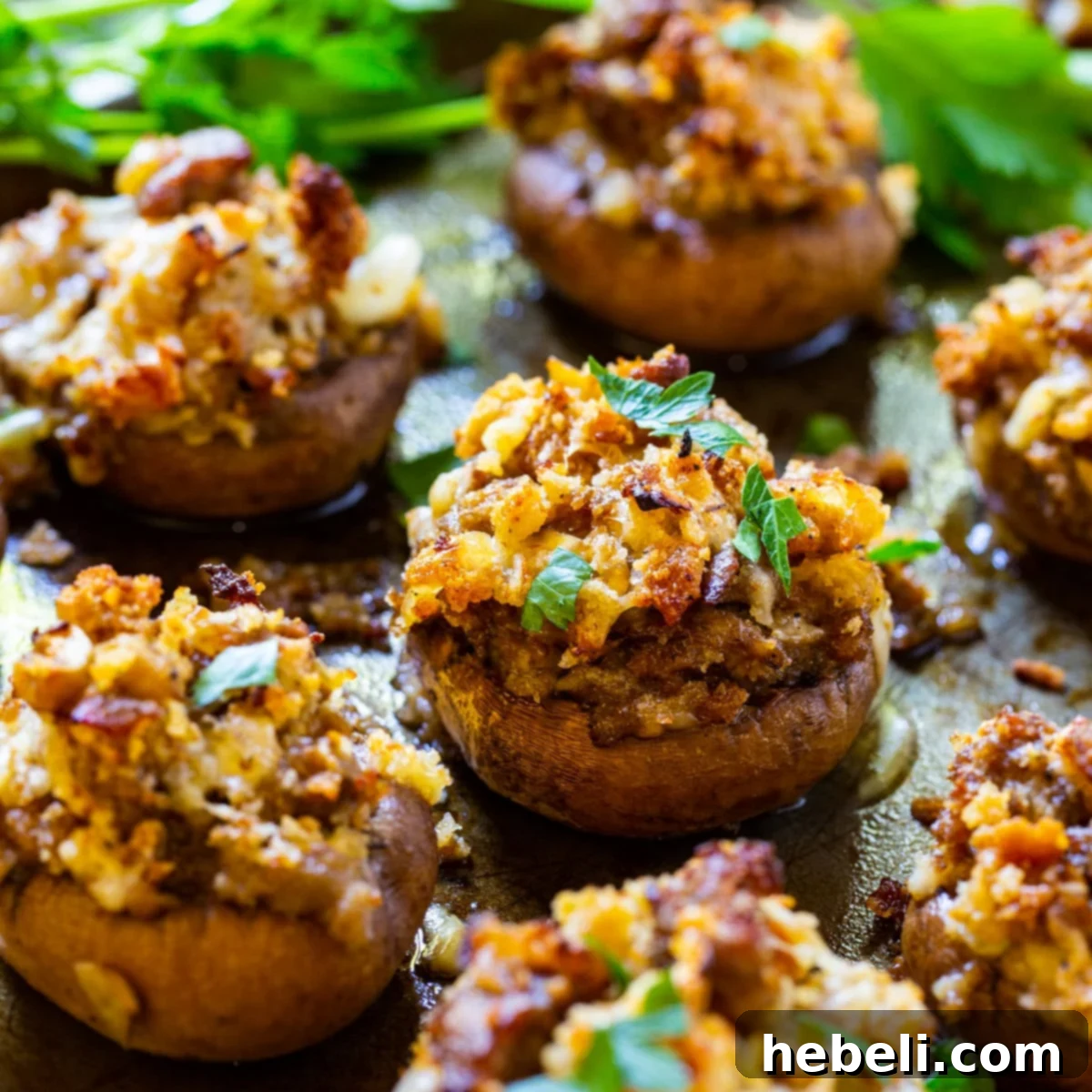 Sausage Stuffed Mushrooms elegantly arranged on a baking sheet, ready for serving.