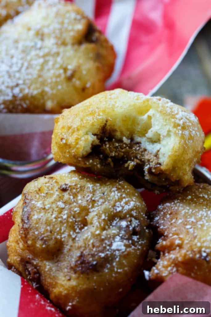 Golden-Fried Peanut Butter Delights 4 A plate of Deep-Fried Peanut Butter Cups, lightly dusted with confectioners' sugar.