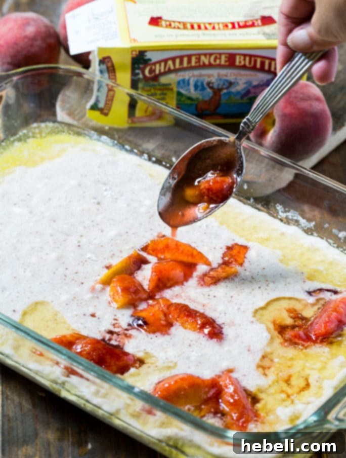 Pouring the simple flour, sugar, and milk batter over melted butter for peach cobbler