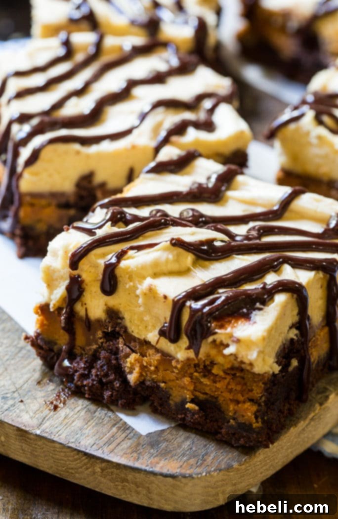 Ingredients for Peanut Butter Cup Brownies laid out, including brownie mix, Reese's cups, butter, and sugar